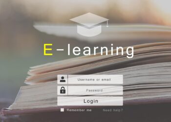 Açık bir kitabın üzerinde e-öğrenme başlığı ve giriş paneli yer alıyor.