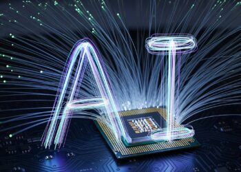 Bilgisayar işlemcisi üzerinde fiber optik kablolarla parlayan yapay zeka harfleri.